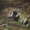 Oblique aerial view centred on the remains of the broch, taken from the NE.