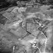 Sunnybrae, oblique aerial view, taken from the E, showing an area with burnt mound in the bottom right-hand corner.
