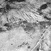 Cnoc Achadh na h-Uaighe, Achnahuie, oblique aerial view, taken from the WSW, showing small cairns and an area with a hut-circle, small cairns, lynchets and a possible hut in the centre of the photograph.