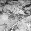 Cnoc Achadh na h-Uaighe, Achnahuie, oblique aerial view, taken from the SW, showing small cairns and an area with a hut-circle, small cairns, lynchets and a possible hut in the centre of the photograph.