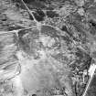 Dremergid, oblique aerial view, taken from the SSW, centred on an area defined as an archaeological landscape, and burnt mound. A hut-circle, small cairns and a bank are visible in the upper right-hand corner of the photograph.