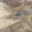 Oblique aerial view centred on the farmsteading, taken from the NNE