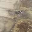 Oblique aerial view centred on the farmsteading, taken from the NW