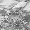 Oblique aerial view centred on the farmsteading, taken from the SW