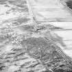 Oblique aerial view centred on the farmsteading, taken from the S