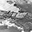 Oblique aerial view centred on the remains of the mound, mast and rig, taken from the N.