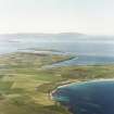 Aerial view of Orkney, Burray, general view taken from the E of Burray, Burray village, Hunda Island with Scapa Flow and Hoy in the background.  Also visible is St Lawrence's Church at Southtown.