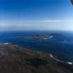 General oblique aerial view centred on the Island with the causeway and village adjacent, taken from the NW.