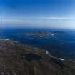 General oblique aerial view centred on the Island with the causeway and village adjacent, taken from the NW.