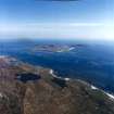 General oblique aerial view centred on the Island with the causeway and village adjacent, taken from the NW.