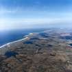 General oblique aerial view looking across the machair and Frobost on the coast of South Uist, taken from the SSE.