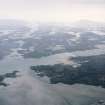 General oblique aerial view over the Isle of Benbecula with Eabhal in the distance, taken from the SW.