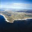 General oblique aerial view over the Isle of Benbecula with Eaval and Ronay in the distance, taken from the SSW.