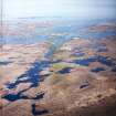 General oblique aerial view looking across the E of the Isle of Benbecula and Loch Uisgebhagh, taken from the W.