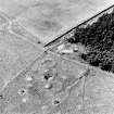 Oblique aerial view of Upperton centred on the remains of hut-circles and a field-system, taken from the E.