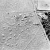 Oblique aerial view of Upperton centred on the remains of hut-circles and a field-system, taken from the NE.