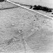 Oblique aerial view of Buntait centred on the remains of hut-circles and a field-system, taken from the NNW.