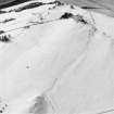 Oblique aerial view of Glaichoile centred on the remains of small cairns and a field-bank, taken from the ENE.