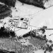 Oblique aerial view of Guisachan centred on a farmsteading, taken from the WNW.