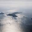 General oblique aerial view looking towards the Shiant Islands, taken from the NW.