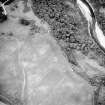 Oblique aerial view centred on the cropmarks of the ring-ditch, taken from the SW.