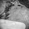 Oblique aerial view centred on the cropmarks of the possible ring-ditch with ring-ditch adjacent, taken from the SW.