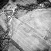 Oblique aerial view centred on the cropmarks of the possible enclosure, rig and linear cropmarks, taken from the N.
