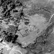 Oblique aerial view of Balbeg centred on the remains of a farmstead, taken from the SE.