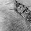 Balblair, oblique aerial view,taken from the SW, centred on the cropmarks of a possible barrow.