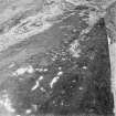 Oblique aerial view of Garbeg centred on the remains of hut-circles, buildings and a field-system, taken from the SSW.