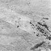 Oblique aerial view of Garbeg centred on the remains of hut-circles, buildings and a field-system, taken from the NNW.