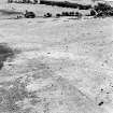 Oblique aerial view of Garbeg centred on the remains of hut-circles, buildings and a field-system, taken from the NW.