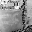 Ballindoun, oblique aerial view, taken from the SW, centred on the cropmarks of two palisaded enclosures and a round house.