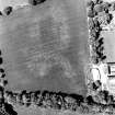 Ballindoun, oblique aerial view, taken from the SSE, centred on the cropmarks of two palisaded enclosures and a round house.