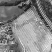Charlestown, oblique aerial view, taken from the SE, centred on the cropmarks of an enclosure and a ring-ditch.