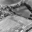 Charlestown, oblique aerial view, taken from the NE, centred on the cropmarks of an enclosure and a ring-ditch.