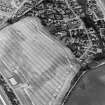 Charlestown, oblique aerial view, taken from the NW, centred on the cropmarks of an enclosure and a ring-ditch.