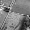 Oblique aerial view centred on the cropmarks of the pits and cropmarks, taken from the NNE.