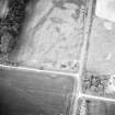 Oblique aerial view centred on the cropmarks of the pits and cropmarks, taken from the SW.