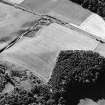 Oblique aerial view centred on the cropmarks of possible pits and further cropmarks, taken from the ESE.