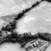 Allangrange, oblique aerial view, taken from the NNE, centred on the cropmarks of a possible settlement. Allangrange House is visible in the bottom left-hand corner of the photograph.