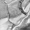 Ferryton Point, oblique aerial view, taken from the NE, centred on the cropmark of a ring-ditch. Ferryton Storehouse is visible in the bottom left-hand corner of the photograph.