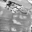 Mains of Gartan, oblique aerial view taken from the NE, centred on the remains of a motte and the cropmark of a possible enclosure.  The Mains of Garten is visible in the top centre of the photograph.