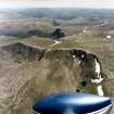 General oblique aerial view looking over Cairn Lochan and the Cairngorms towards the Grampian mountains, taken from the NW.