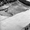 Oblique aerial view centred on the cropmarks of the possible barrow and pits, taken from the NW.