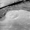Oblique aerial view centred on the cropmarks of the possible enclosure, taken from the S.
