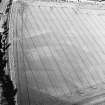 Pilmuir, oblique aerial view, taken from the SW, centred on the cropmarks of a barrow cemetery.