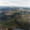 General oblique aerial view looking over Loch Etchachan and the Cairngorm mountains towards the Monadhliath mountains, taken from the ENE.