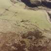 Oblique aerial view of Bairn's Hill centred on the remains of a farmhouse, farmsteading and township, taken from the NNW.