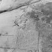 Oblique aerial view of Bairn's Hill centred on the remains of a farmhouse, farmsteading and township, taken from the ENE.